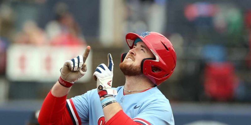 Time Elko playing baseball for Ole Miss; looking up to sky and pointing fingers upward